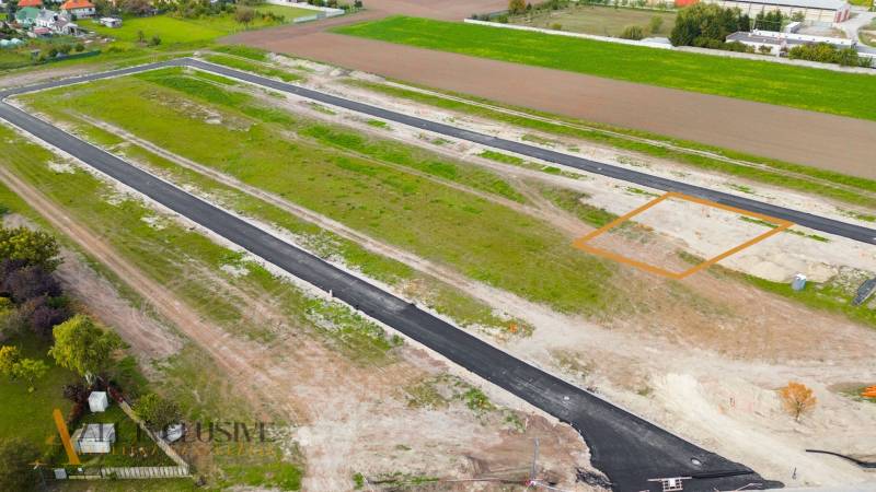 Built road on land designated for housing in Amadeho Kračany, Kostolné Kračany.
