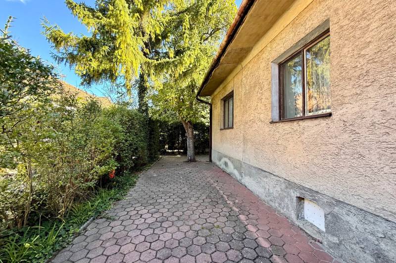Family house on Prostredná Street in Svätý Jur with a sidewalk and greenery.