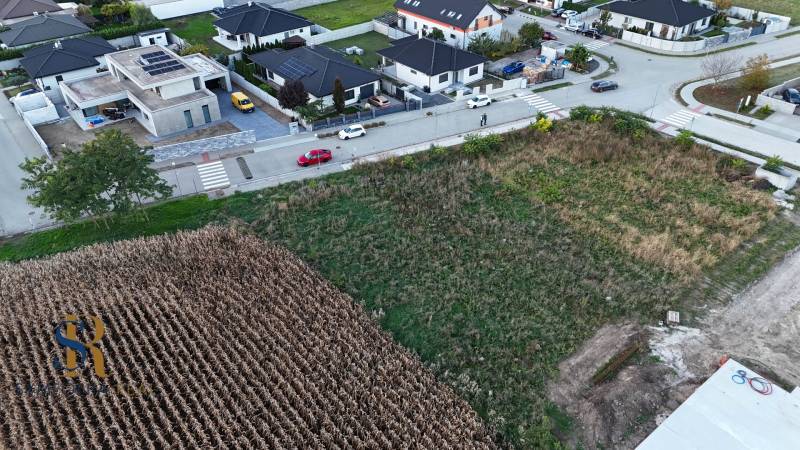 Aerial view of plots - housing in the town of Voderady, surrounded by modern houses.