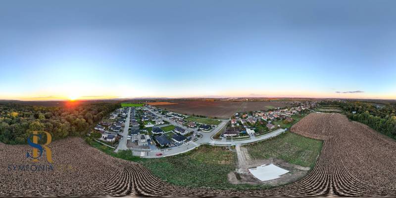 Panoramic view of residential plots around Voderady, with a view of the fields.