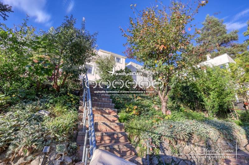The staircase to the family house on the street in Bratislava - Devín surrounded by greenery.