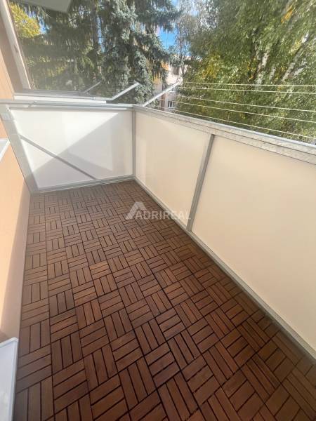 Balcony in a 3-room apartment on Majakovského Street in Lučenec, floor with wooden decor.
