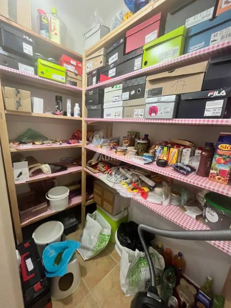 Storage space with lots of boxes and household items in a 3-room apartment.