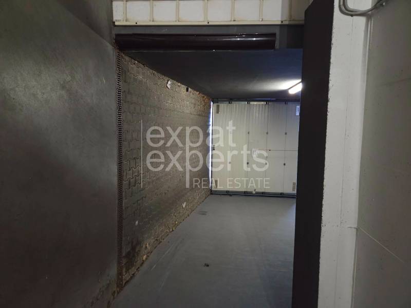 Garage in Bratislava-Ružinov on Pri strelnici with a dark floor and lighting.