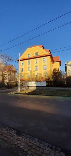 Yellow building with a sloped roof on Brnianska Street, Bratislava - Old Town.