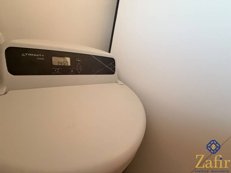 The display of the Trinity Home device in the family house shows a value of 1457.