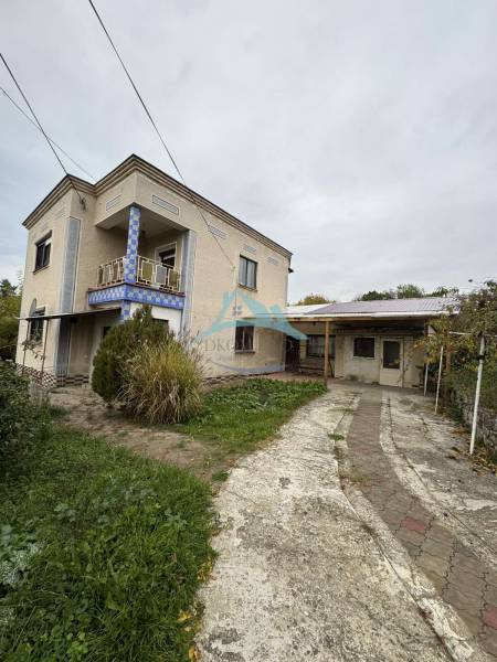 A family house on Gaštanová Street in Vinica with a landscaped walkway and exterior.