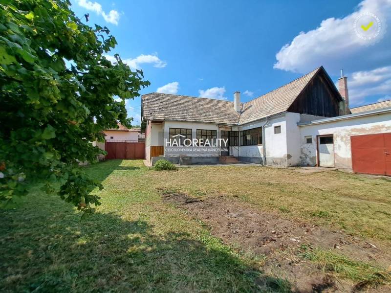 A family house in Zvolen with a lawn and an annex in the countryside.