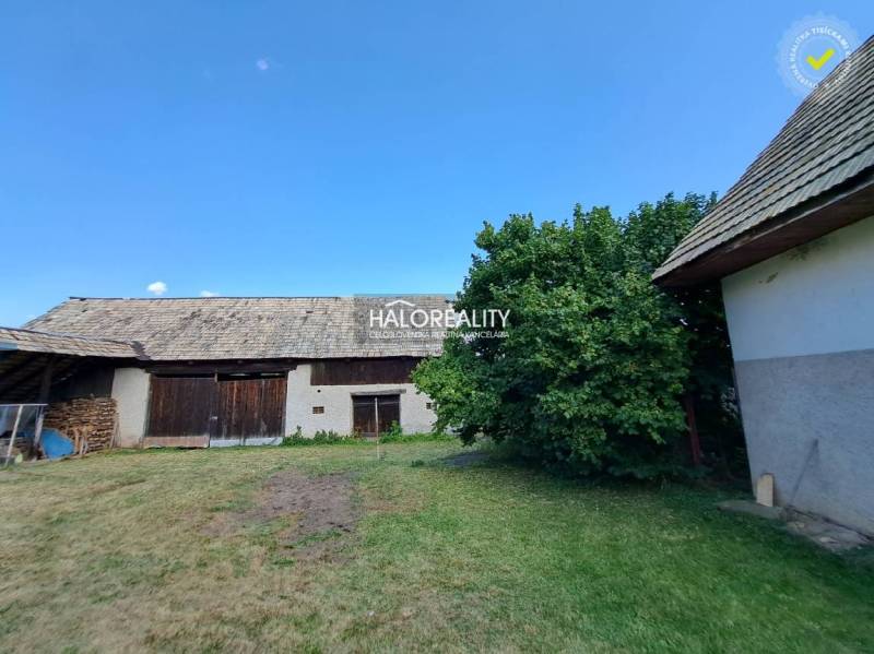 A family house in Zvolen with a yard, shelter, and trees, ideal for country-style living.