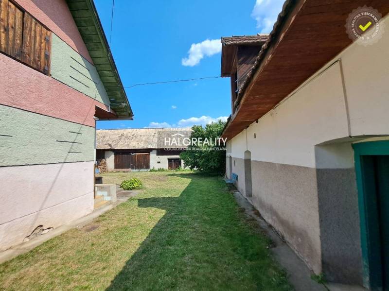 A family house in Zvolen with courtyards, a grassy garden, and extensions.
