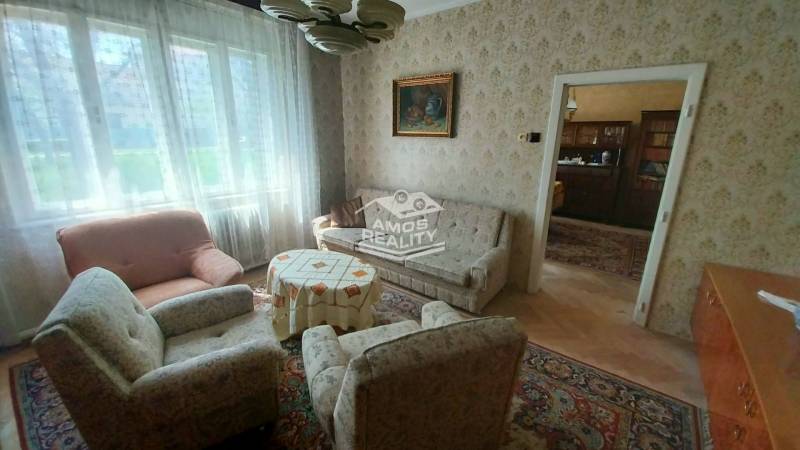 Living room on Štúrova Street with armchairs and a decorative table in a family house.