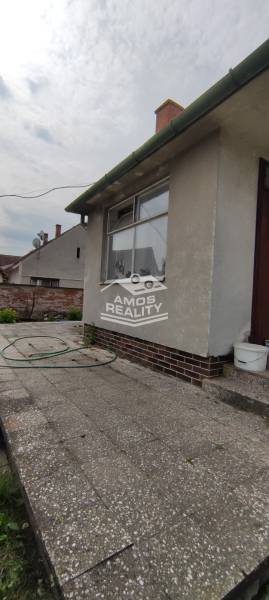 Family house on Štúrova Street with a terrace and a garden hose in the yard.