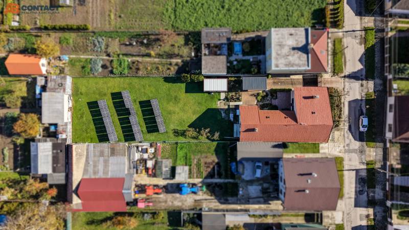 A top view of a family house with photovoltaic panels in the garden on Južná Street, Veľké Orvište.