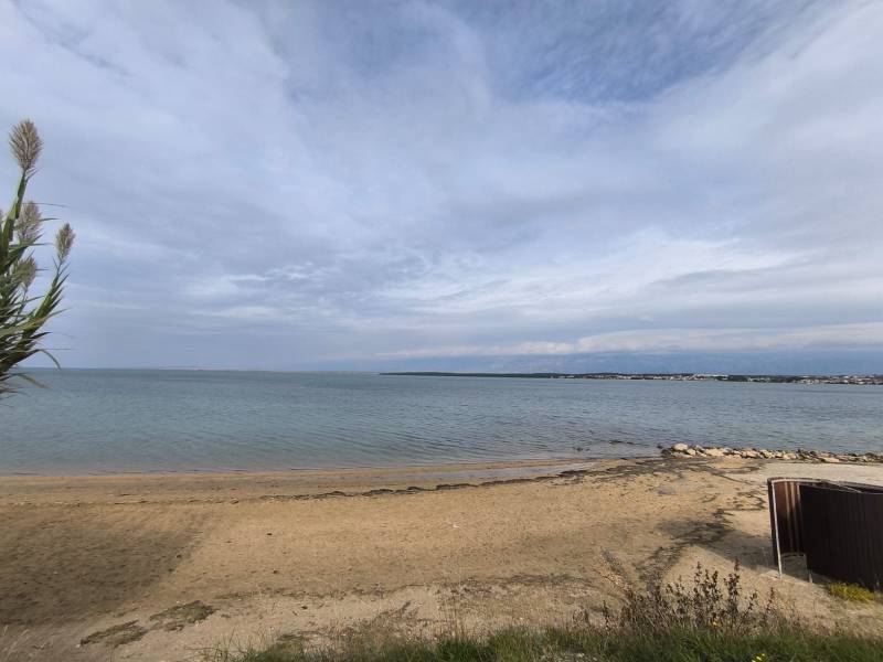 The beach and sea at the city coast in the resort of Nin.