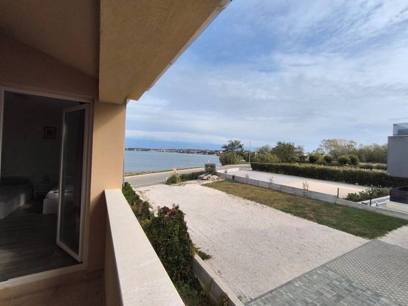 A view of the sea from the balcony in a 3-room apartment overlooking the coast.