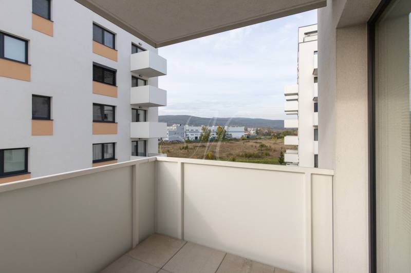 The balcony of a 2-room apartment on Eduarda Venzla with a view of greenery in Bratislava - Rača.