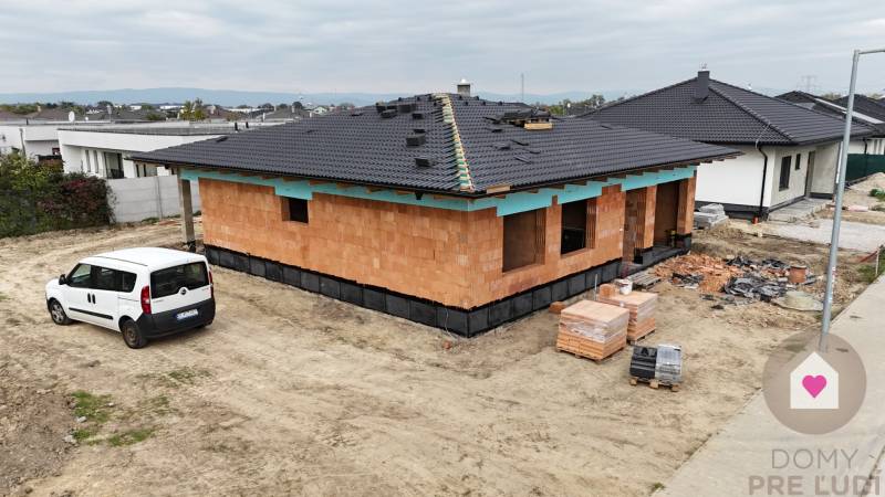 Construction of a family house in Bernolákovo with a white van on the property.