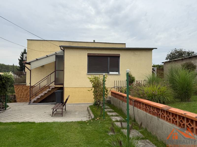 A family house on Jilemnického Street in Dvory nad Žitavou with a landscaped garden and terrace.