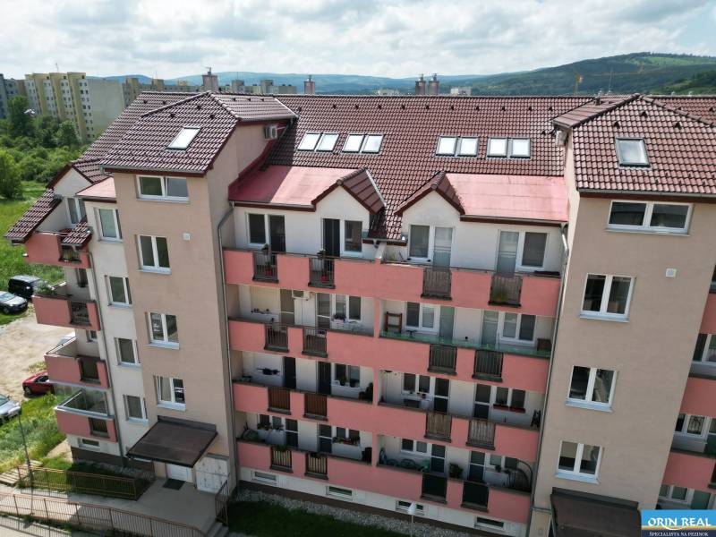 Apartment building in Pezinok on Dona Sandtner Street with a view of the surrounding countryside.