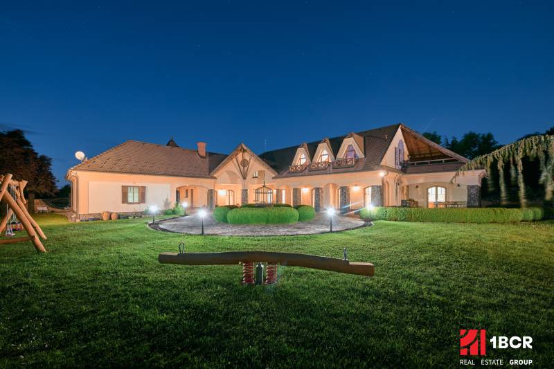 A villa on Park Street in Hviezdoslavov with a lit garden and a children's playground.