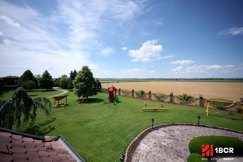 The garden with a children's playground at the villa on Park Street in Hviezdoslavov.
