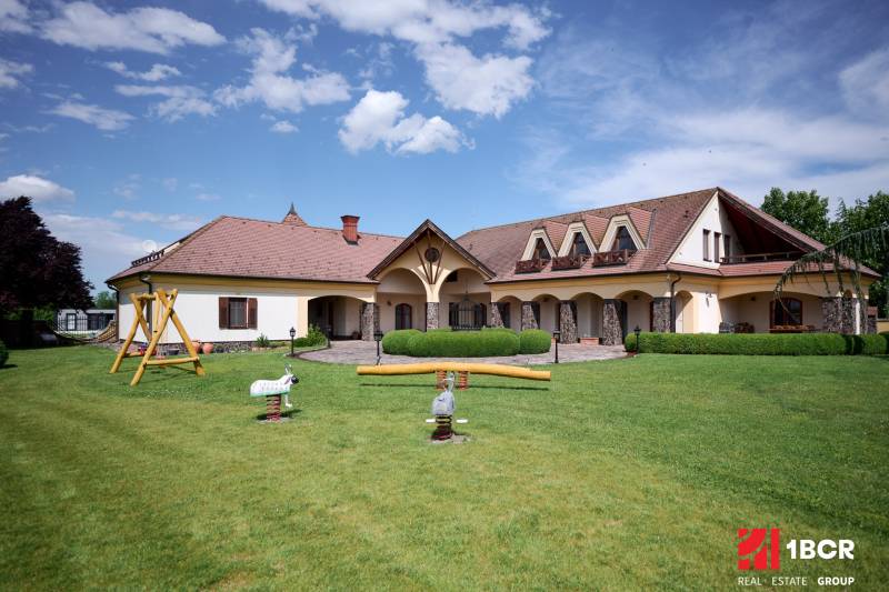 A villa on Parková Street in Hviezdoslavov with a spacious garden and swings.