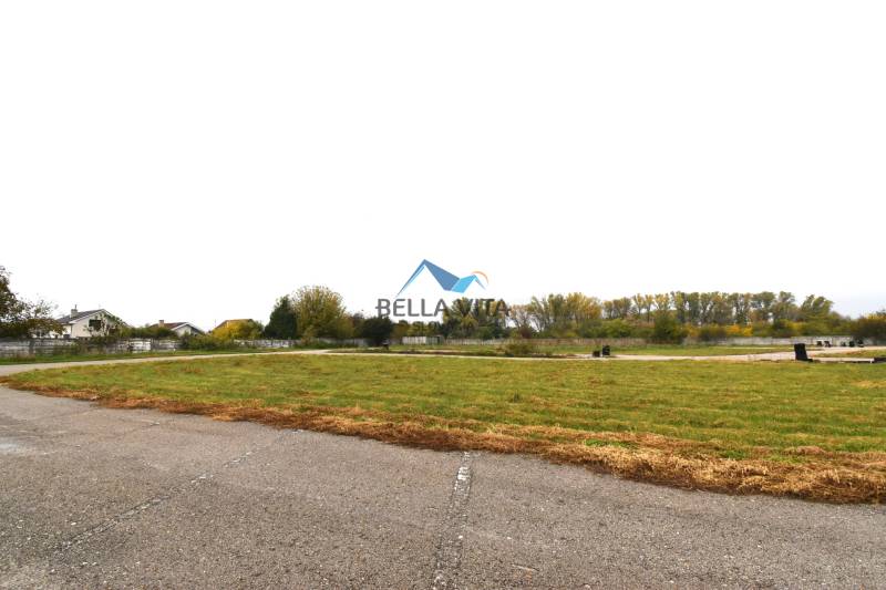 Commercial plots on Nebojsa Street in Galanta, visible road and green spaces.