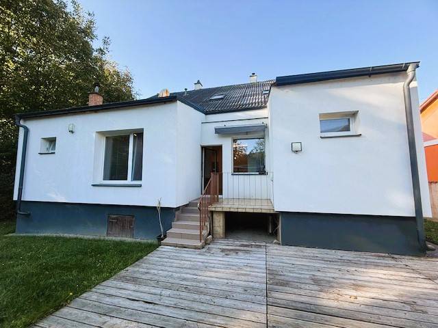 Family house on Industriestraße in Hainburg an der Donau with a terrace and lawn.