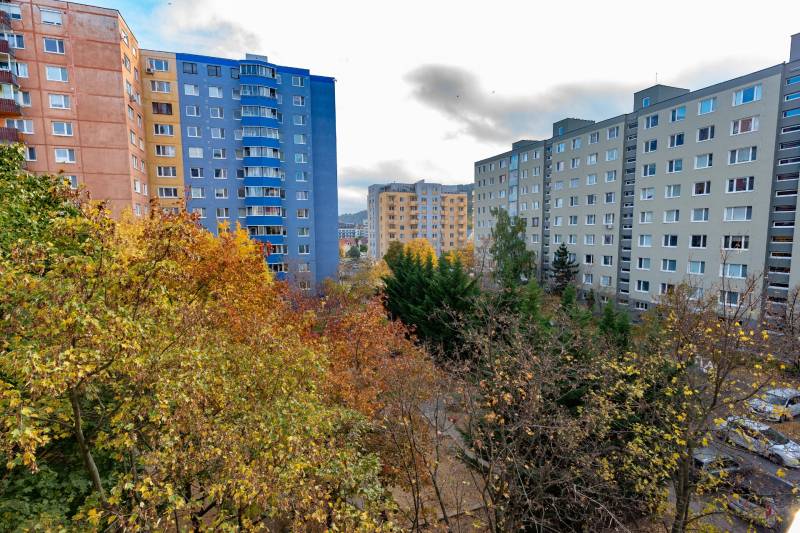 A view of apartment buildings and autumn trees in Bratislava on Ján Smrek Street.
