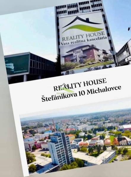 Building with a real estate agency advertisement on Štefánikova Street 10, Michalovce.