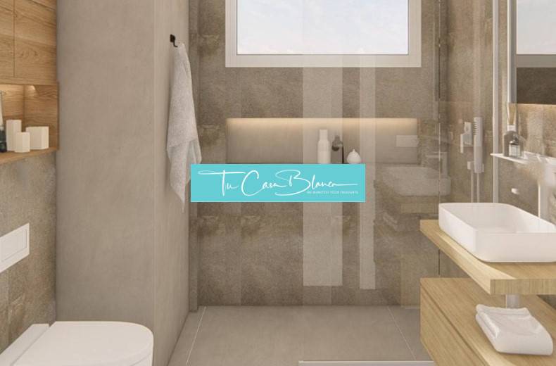 Bathroom in a holiday apartment with a sink, shower, and shelves.