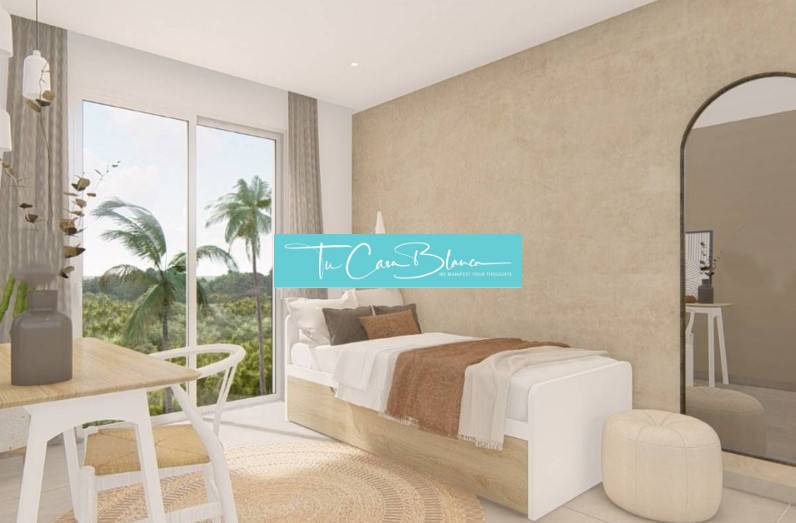 Recreational apartment with a cozy bed, mirror, and view of palm trees.