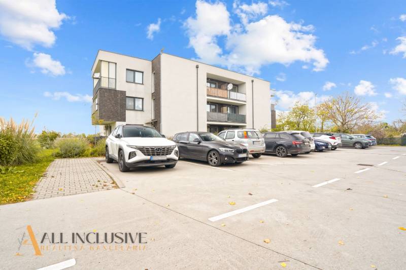 Parking lot in front of the apartment building in Blatná na Ostrove near the 3-room apartment.