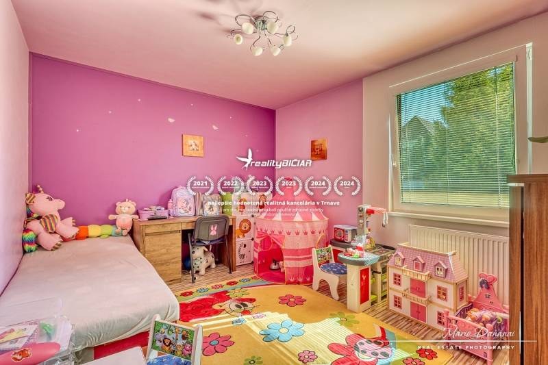 Children's room in a family house with toys and furniture, floor with wooden decor.