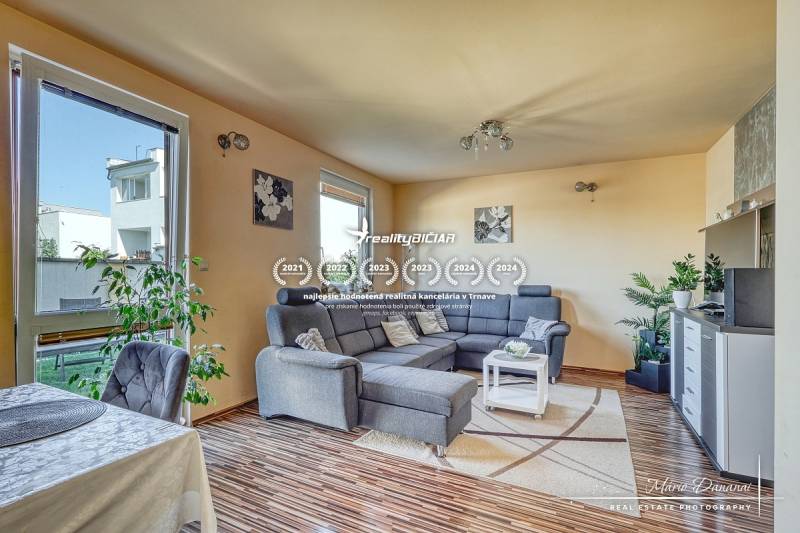 A living room in a family house with a comfortable sofa corner and a wooden decor floor.