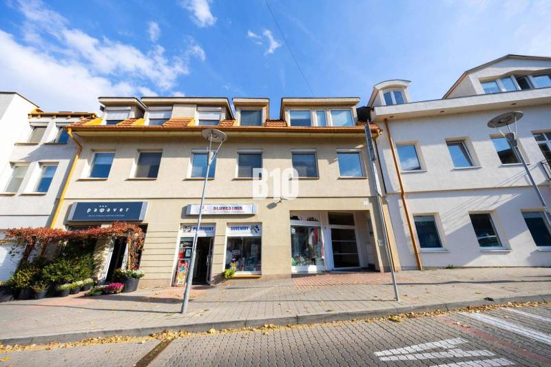 The building on Zámocká Street in Bratislava - Old Town, with commercial establishments on the ground floor.