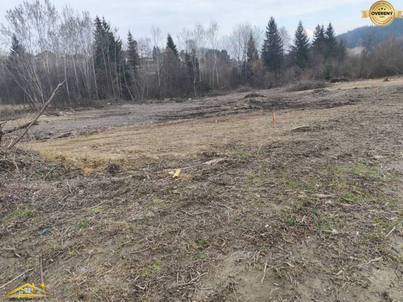Building plot in Raková surrounded by trees, ready for new housing.