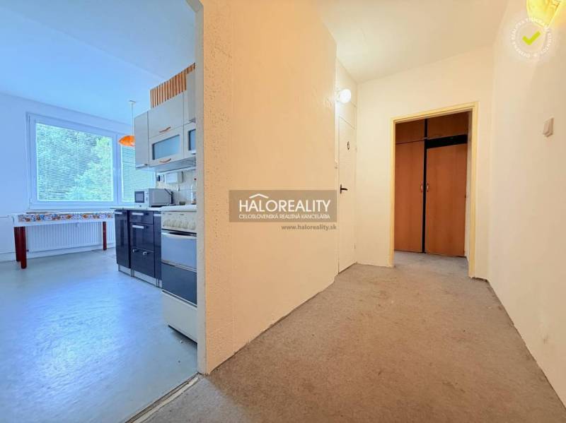 A spacious hallway leads into the kitchen of a 2-room apartment with a bright interior.