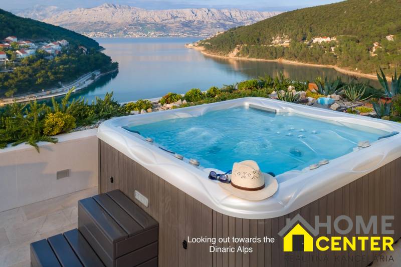 A villa in the town of Bol with a hot tub and a panorama of mountains and the sea on the horizon.