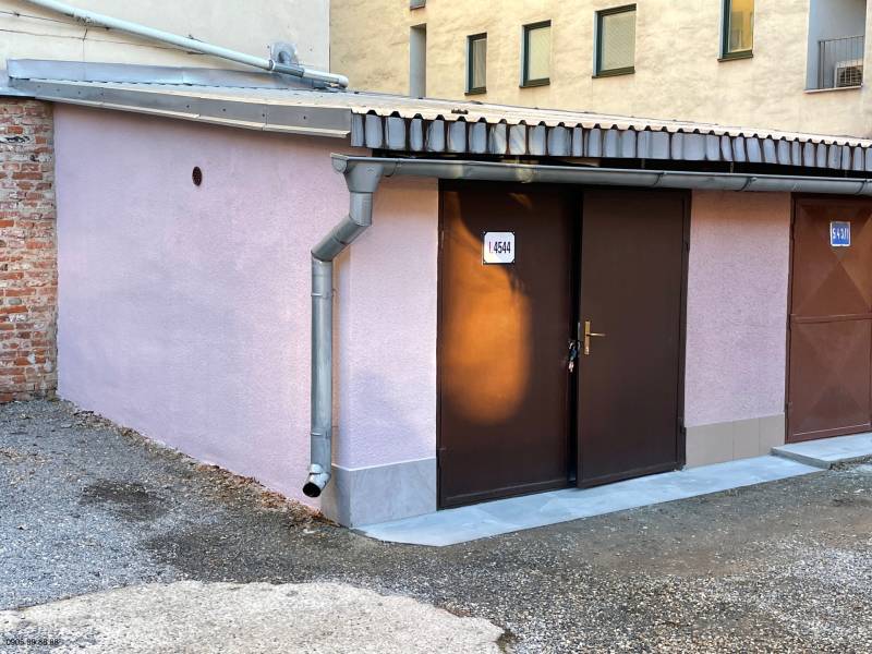 Garages on Mlynska Street in Košice - Staré Mesto district with light purple plaster.