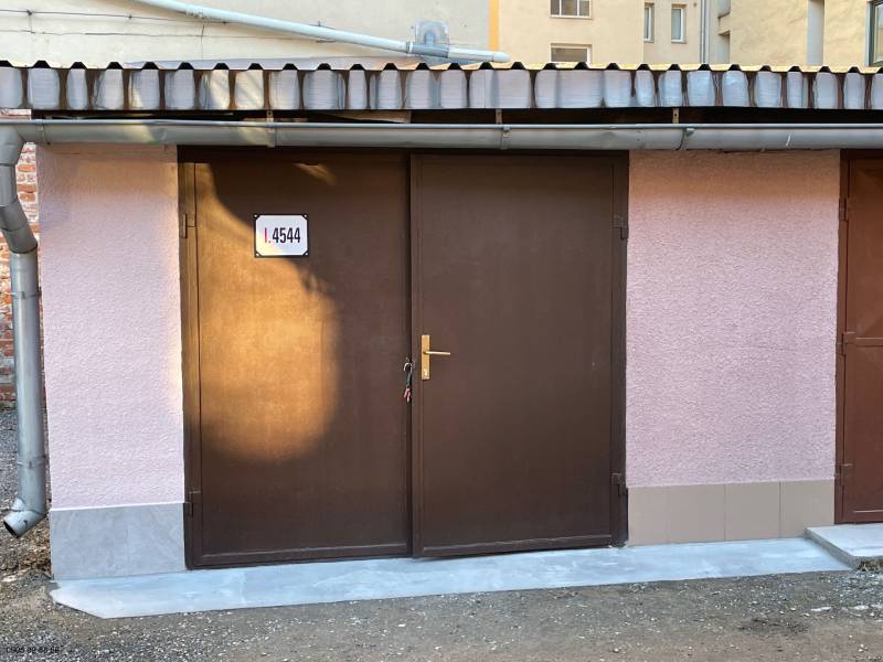 Brown garage doors on Mlynská Street in the Staré Mesto district in Košice.