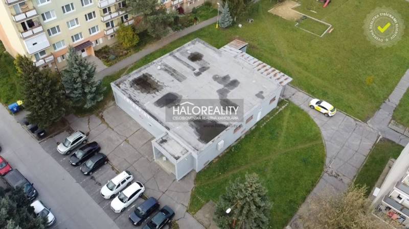 In Rimavská Sobota, the commercial spaces are surrounded by apartment buildings and parking spaces.