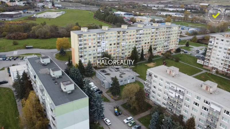 An aerial view of the housing estate in Rimavská Sobota with apartment buildings and greenery.