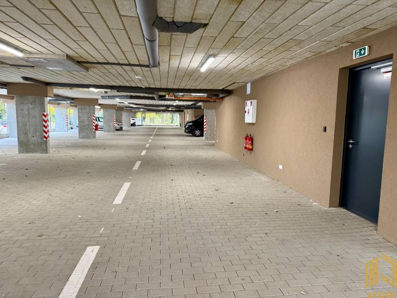 Parking lot with parking spaces and markings, tiled floor, in garages.