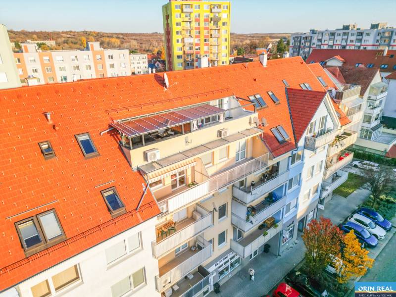 Apartment building on Vajanského Street in Modra with a colorful facade and a red roof.
