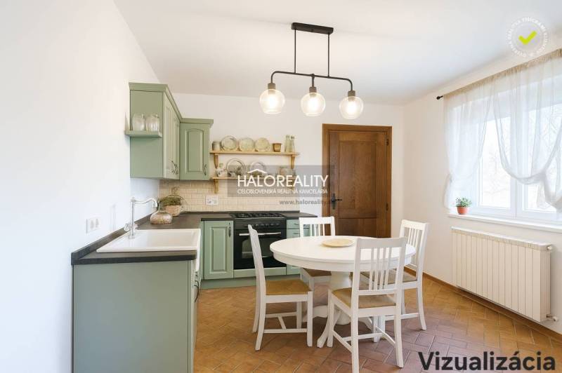 A kitchen in a family house with a wooden floor decor and a green kitchen unit.