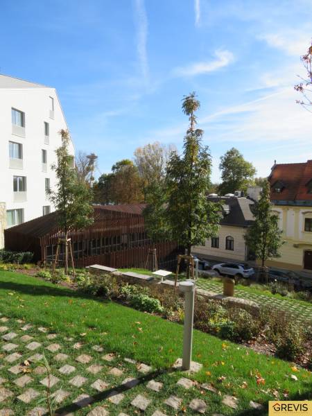 Garden and architecture on Floriánska Street, Bratislava - Old Town, with a view of a 3-room apartment.