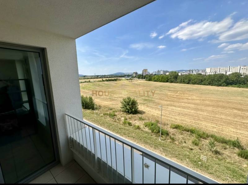 View from the balcony of fields and the city in Bratislava on Labutia Street, Petržalka.