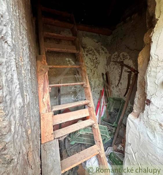 Old stairs to the attic with wooden decor in a family house.