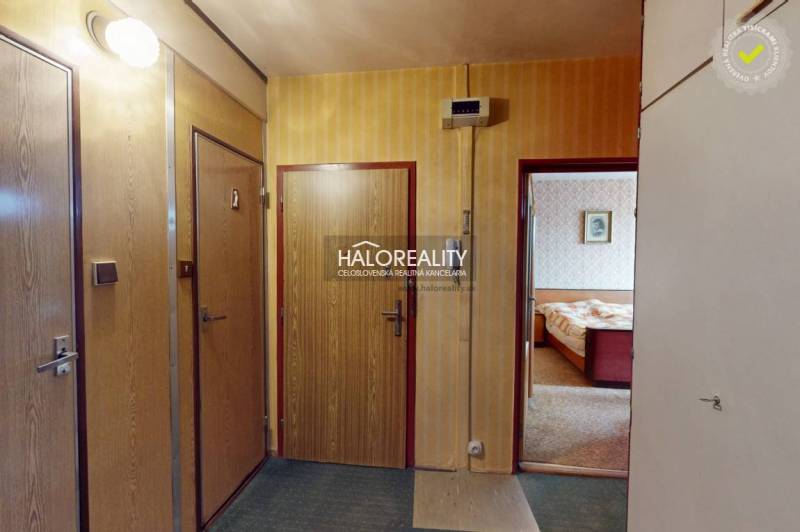 In the 3-room apartment, there is an entrance hall with wood-decor doors and a translucent light.